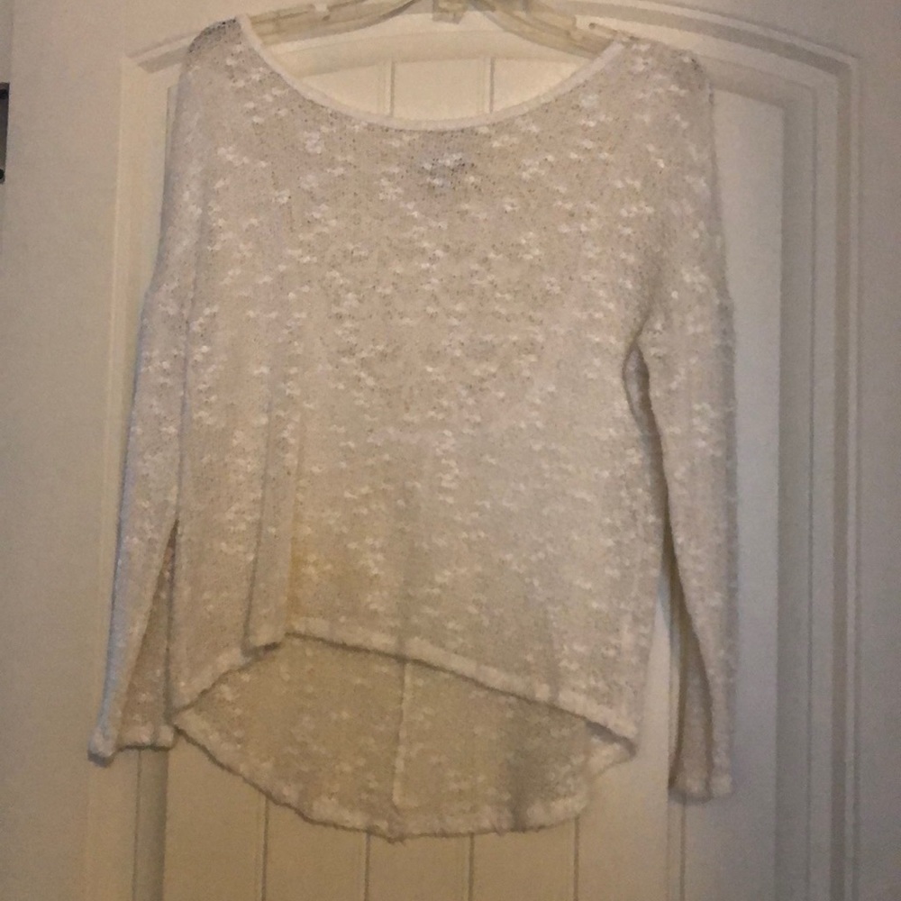 Delia’s white sweater